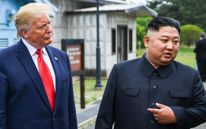 North Korea's leader Kim Jong Un speaks as he stands with US President Donald Trump south of the Military Demarcation Line that divides North and South Korea in the Joint Security Area of Panmunjom in the Demilitarized zone