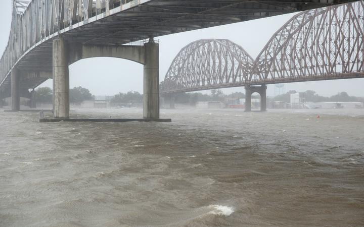 Barry's flood threat lingers as storm slowly sweeps inland