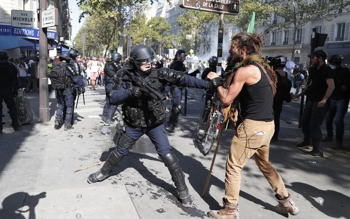 Several hundred protesters clash with police in central Paris