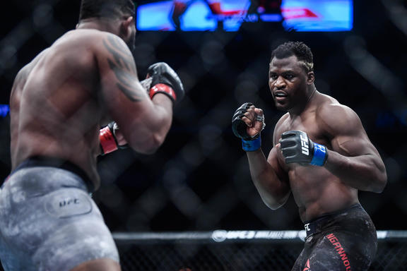 Francis Ngannou of Cameroon and France (blue gloves)  fights Curtis Blaydes of America (red gloves) during the UFC Fight Night at Cadillac Arena in Beijing, China, 24 November 2018.