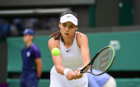 Emma Raducanu playing at Wimbledon