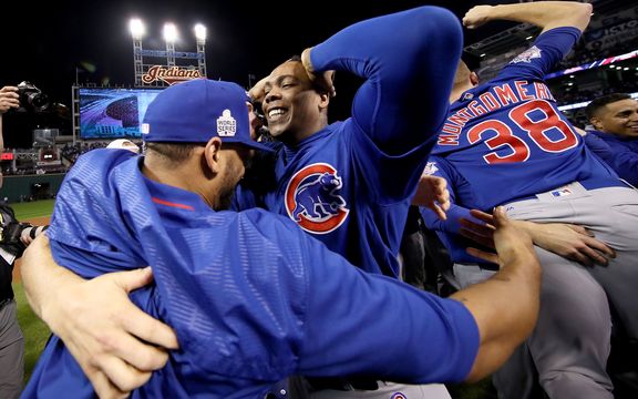 Aroldis Chapman of the Chicago Cubs celebrates with teammates after defeating the Cleveland Indians 8-7 in Game Seven of the 2016 World Series in Cleveland, Ohio.