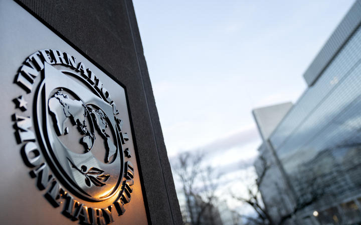 The seal for the International Monetary Fund is seen near the World Bank headquarters, right, in Washington, DC on 10 January, 2022. 