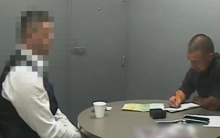 An image taken from video shown to the jury of defendant being interviewed by a police officer at Auckland Central Police Station on 6 December