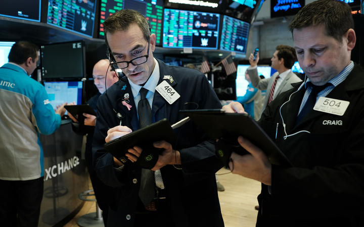 Wall Street slashes billions despite emergency interest rate cut