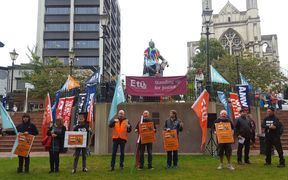 Protesters gather at the Octagon in Dunedin to urge Mondelez to retain the Cadbury factory. 