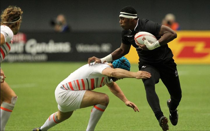 Fiji's Kalione Nasoko tries to beat the England defence