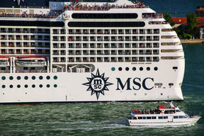 Detail of MSC cruise ship moving through San Marco canal in Venice, Italy. MSC is the world's second largest shipping line in terms of container vessel capacity and also owns 12 cruise ships.