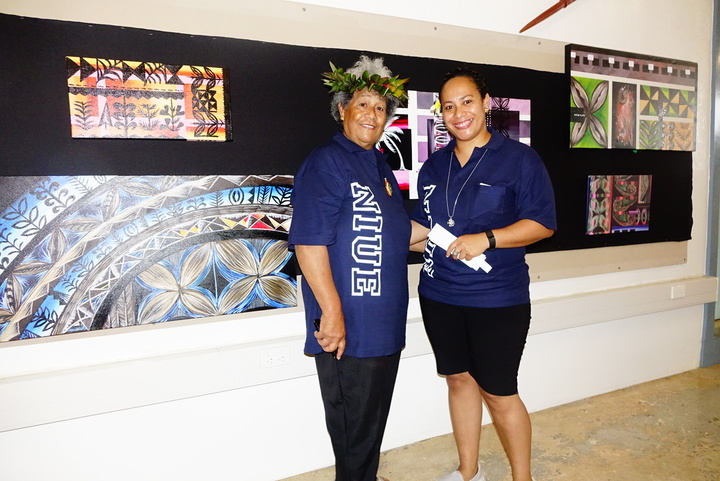Sarah Magaoa with her mother Faso Magaoa, standing with some of her artworks which are on display at the Niue Tourism Centre 