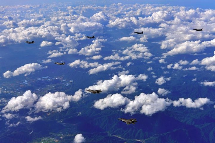 South Korean F-15K fighter jets and US F-35B stealth jet fighters flying over South Korea during a joint military drill.