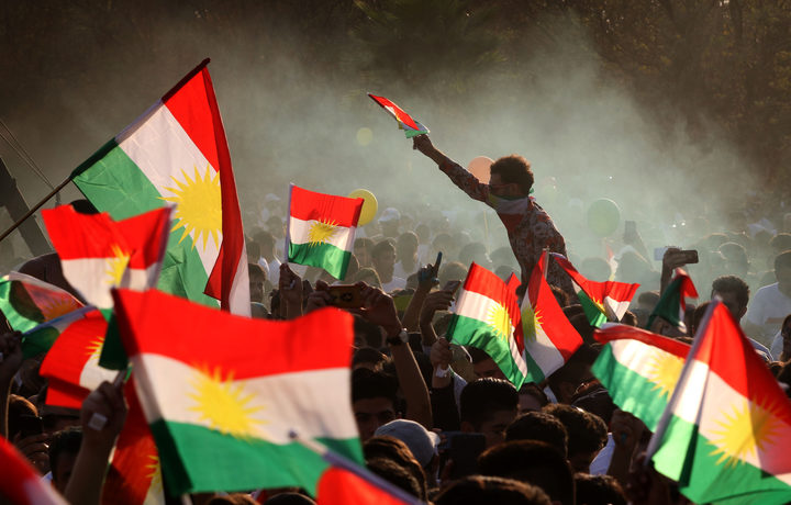 Iraqi Kurds fly Kurdish flags during an event to urge people to vote in the upcoming independence referendum in Arbil, the capital of the autonomous Kurdish region of northern Iraq, on September 15, 2017.