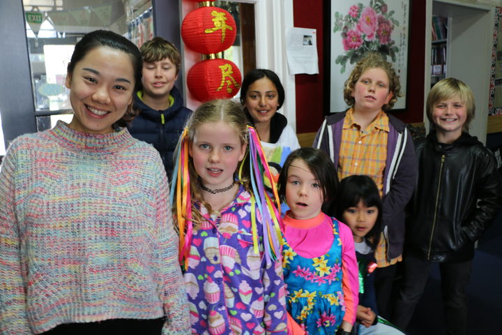 Te Aro Primary students with MLA Chinese teacher Jingwen Zhang.