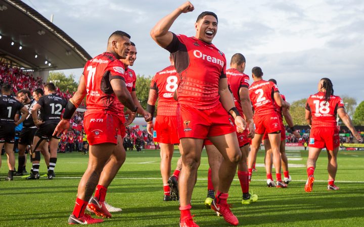 Tonga's Jason Taumalolo and Konrad Hurrell celebrate their win over the Kiwis.