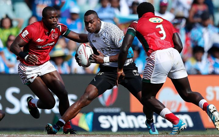Fiji's Sevuloni Mocenacagi attacks the Kenya defence in Sydney.