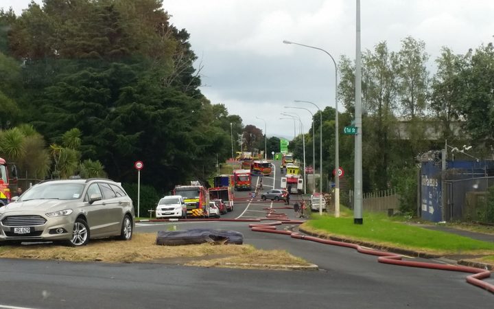 Fire trucks on James Fletcher Drive. They are fighting a fire at a scrap metal yard in Favona.