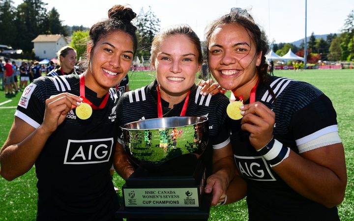 Black Ferns Sevens players Tenika Willison, Michaela Blyde and Stacey Waaka show off their spoils after victory in Canada.