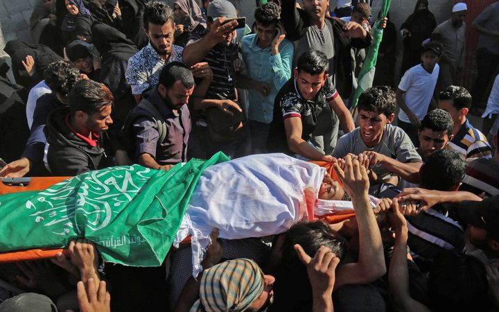Friends and relatives of Palestinian Mahmoud Abu Taima, who was killed during a protest.