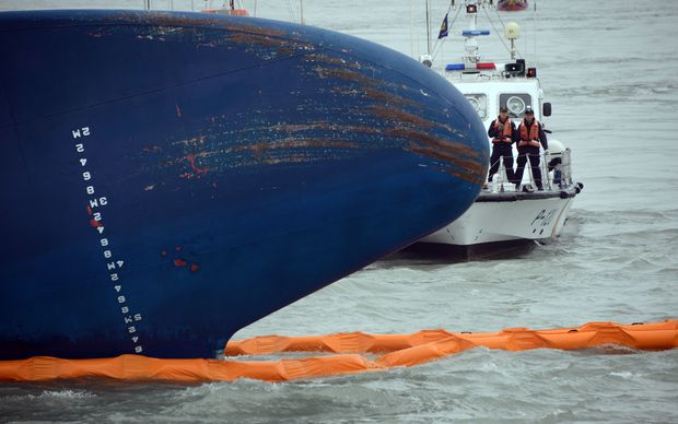 Coast guard crew members at the sunken ferry.