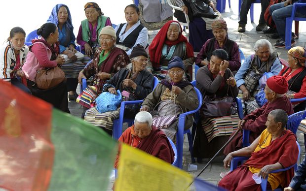 Relatives of the dead Sherpas wait at the Sherpa monastery in Kathmandu on Saturday.