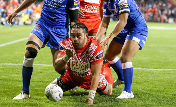 Konrad Hurrell celebrates a try for Tonga.