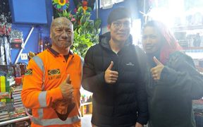 Erana Paraone and Wiremu Keretene with the Coin Save worker.