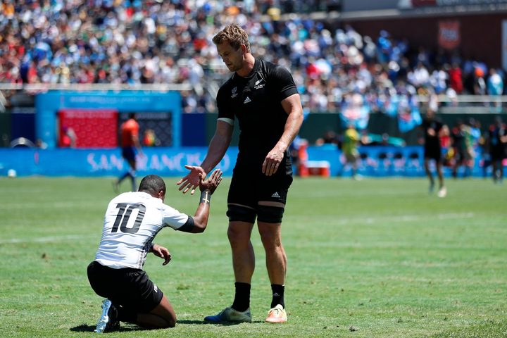 Fiji's Alasio Sovita Naduva and New Zealand captain Scott Curry share a moment post-match.