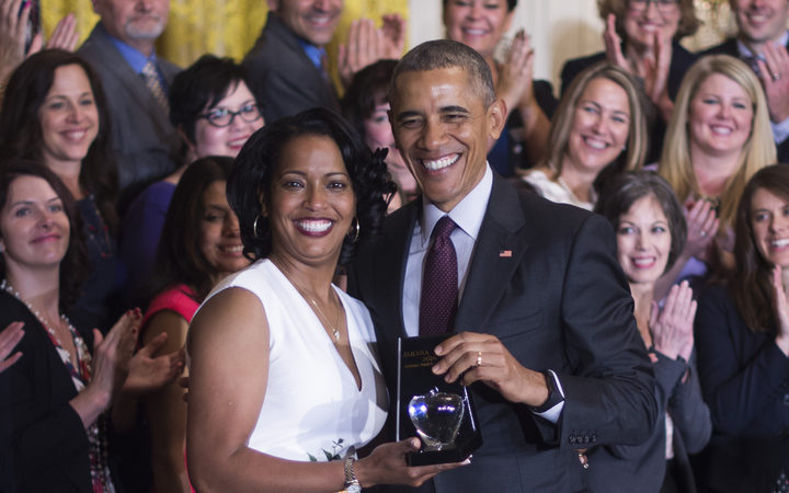 Jahana Hayes celebrates winning the 2016 National Teacher of the Year with US President Barack Obama.