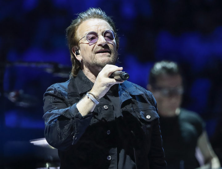 Bono of the Irish rock band U2 performs during the "Experience + Innocence" tour at the United Center in Chicago on May 23, 2018. / AFP PHOTO / Kamil Krzaczynski