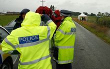 Policemen at the site of the crash near Carterton in 2012. 