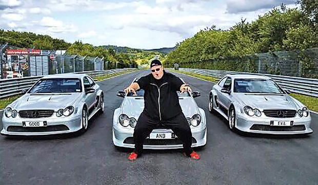 Kim Dotcom with his seized cars