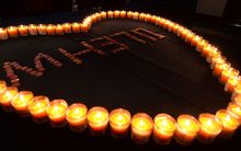 Candles lit for those missing on MH370. 