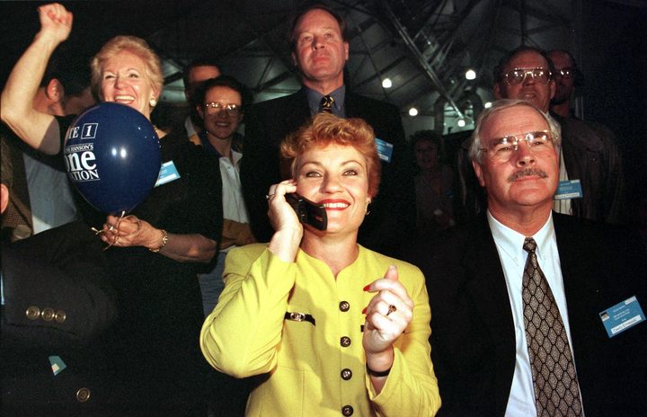  Picture dated 13 June show Anti-Asian MP Pauline Hanson (C) being congratulated by phone as One Nation national director David Ettridge (R) and supporters celebrate in the Brisbane tally room after their fledgling party captured 23 percent of the vote during the Queensland elections.  