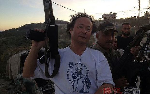 Artist Weiming Chen pictured in what appears to be Syria.