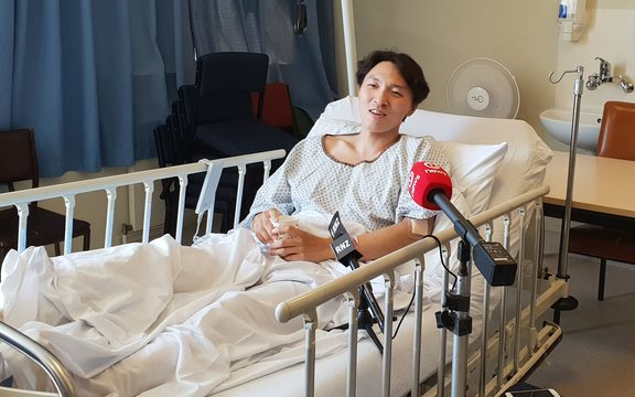 Son Jungho talks to media from his hospital bed.