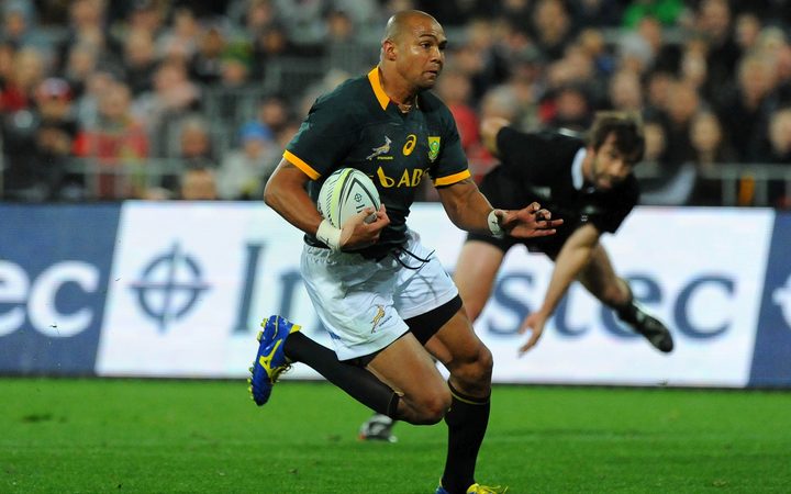South African rugby player Cornal Hendricks makes a burst against the All Blacks in 2014.