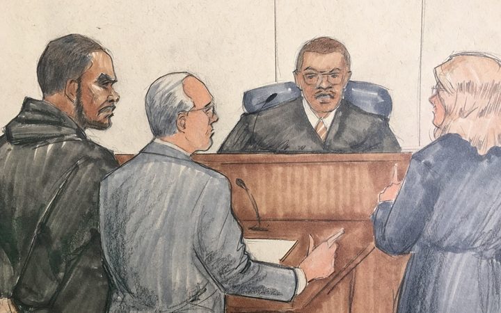 In this courtroom sketch, R&B singer R Kelly, attorney Steve Greenberg and prosecutor Jennifer Gonzalez appears before Cook County Judge John Fitzgerald Lyke Jr. at the Leighton Criminal Courthouse.