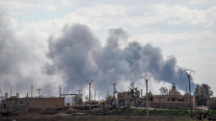 Smoke billows after shelling on the IS group's last holdout of Baghuz.