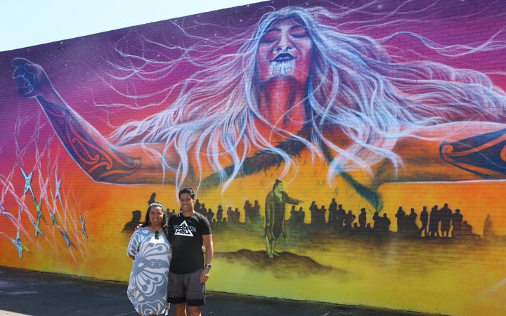 Amiria Puia-Taylor and Bobby MacDonald in front of the Onehunga mural.