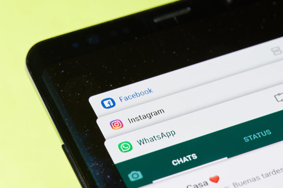 New york, USA - April 26, 2018: Facebook, instagram and whatsapp application windows on smartphone screen close-up