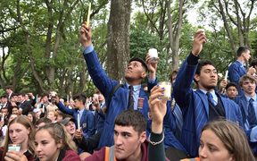Young students attend a vigil in Christchurch today.