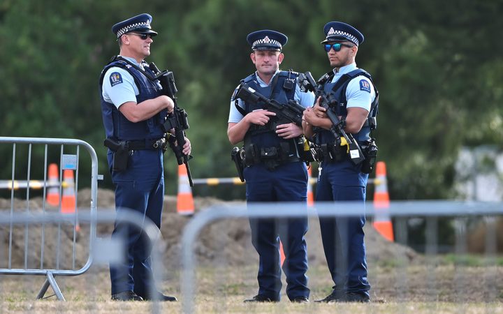 Armed police at the area where graves are being prepared. 20 March 2019