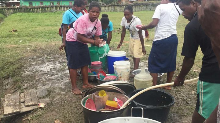 Food pre by volunteers for displaced Papuan villagers in Wamena.