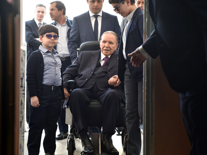Algerian President Abdelaziz Bouteflika  arrives on a wheelchair to vote at a polling station in Algiers. 