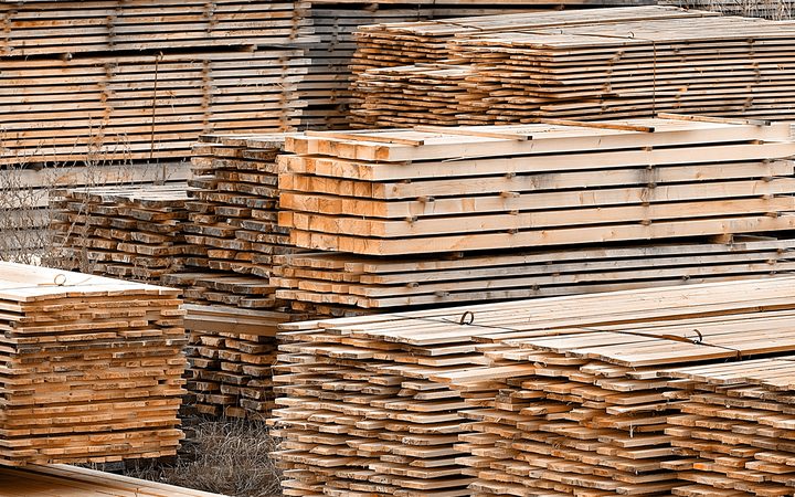 Stacked wood spruce and pine timber for construction buildings