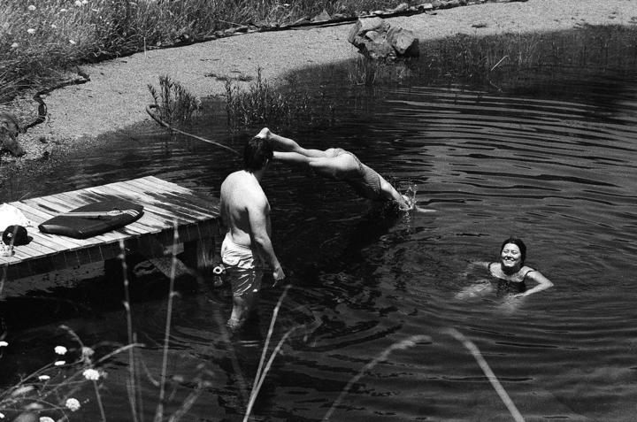 Three of the band members go for a dip
