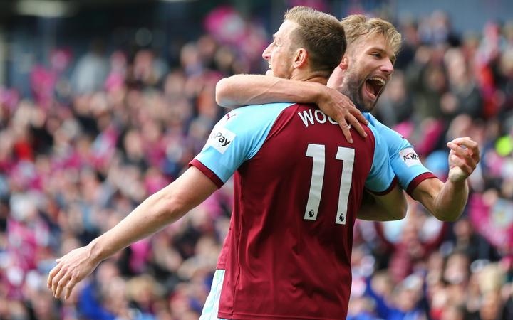 13th April 2019, Turf Moor, Burnley, England; EPL Premier League football, Burnley versus Cardiff City; Chis Wood of Burnley is hugged by Charlie Taylor of Burnley  after he scores with a header in the 90+2 minute to make it 2-0