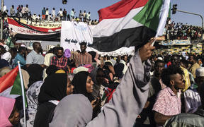 Demonstrators outside the army headquarters in the Sudanese capital Khartoum demand a civilian body to lead the transition to democracy.