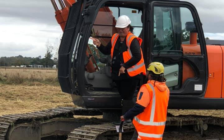 Turning the first sod at the site of the papakāinga at Tuahiwi marae near Kaiapoi.