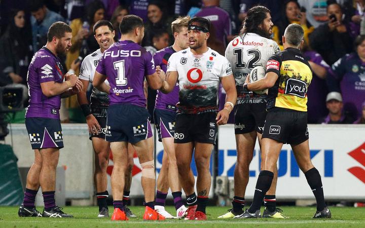 The players shake hands after the Storm seal another Anzac Day win over the Warriors.