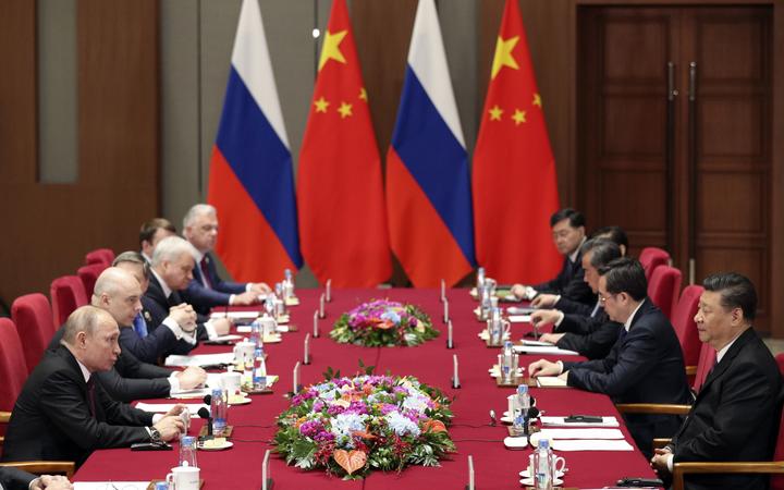 Russian President Vladimir Putin, left, and Chinese President Xi Jinping, right, attend the meeting at Friendship Palace in Beijing Friday, April 26, 2019. 